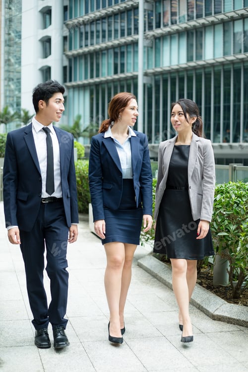 Preview: Business people walking outside office