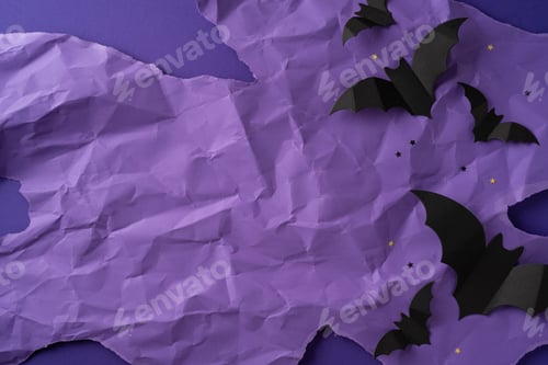 Preview: Crumpled paper background with a Halloween theme featuring bats and small decorative stars