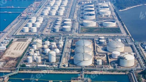 Preview: Large industrial petroleum refinery plant and oil storage tank farm at maritime loading terminal. Gl