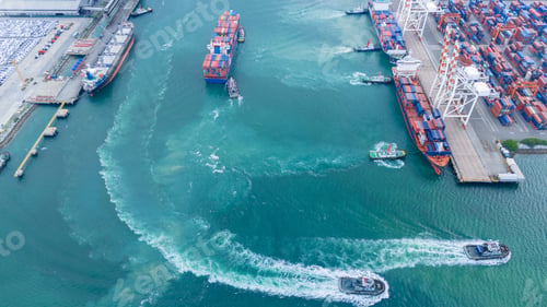 Preview: multiple tugboats assisting and maneuvering large container ships in a busy industrial harbor. Conce