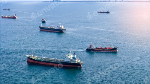 Preview: Fleet of oil tanker ships navigating the blue ocean in daylight. Global maritime logistics, energy t