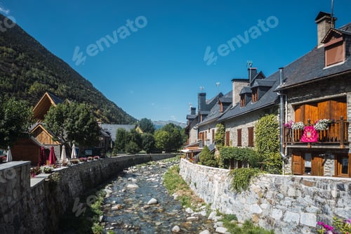 Preview: Garona river flowing through vielha, val d'aran village
