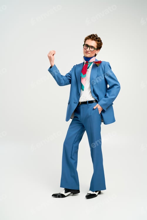 Preview: Fashion forward young man showcases a unique style in a modern studio setting
