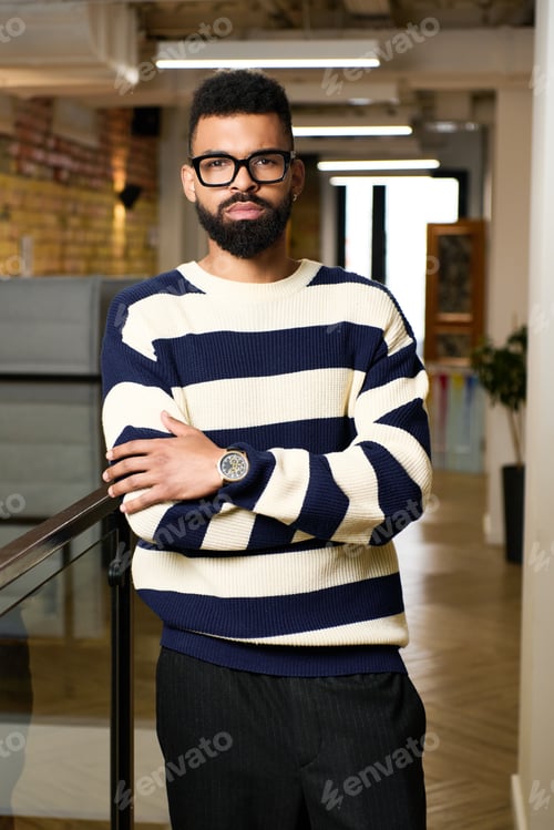 Preview: Handsome young man posing confidently in a stylish urban setting with contemporary design elements