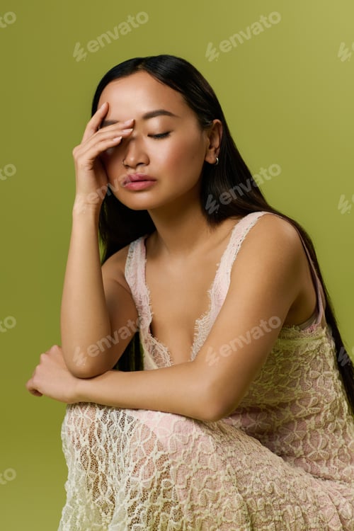 Preview: Elegance shines through a beautiful young woman in summer fashion captured in a studio