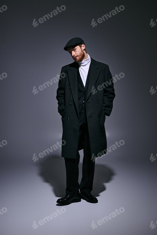 Preview: Stylish red haired man displays elegant fashion in a dimly lit studio setting