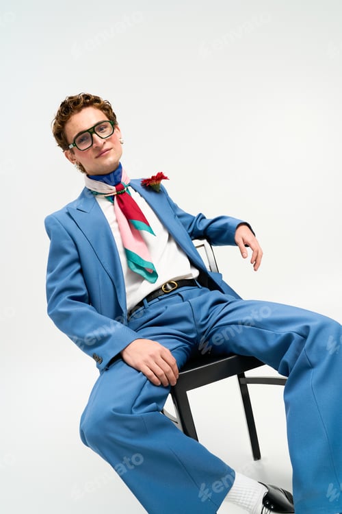 Preview: Fashion forward young man exudes style in a trendy blue outfit during a studio session