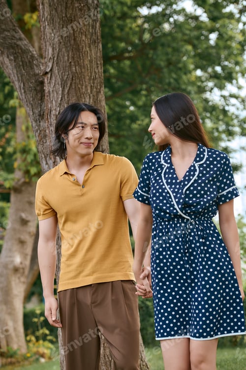 Preview: Stylish young couple shares a moment of love in a serene outdoor setting