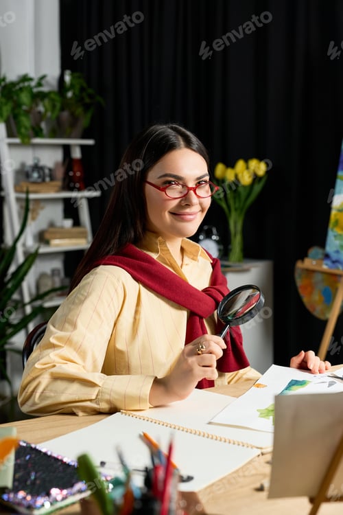 Preview: Charming young artist enjoying a creative moment in her cozy home studio environment
