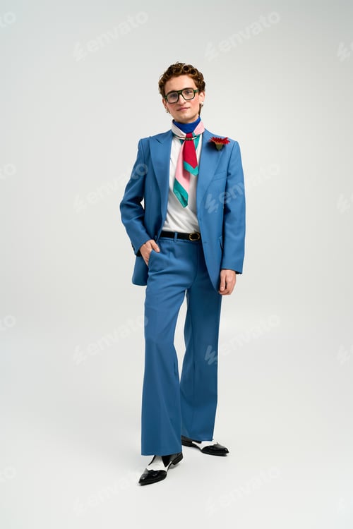 Preview: Stylish young man expressing his unique fashion sense in a modern studio setting