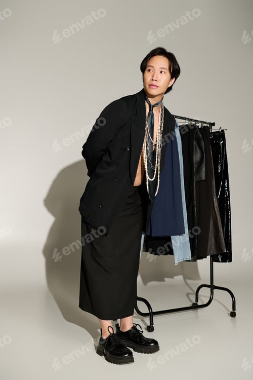 Preview: Artistic vibe unfolds backstage as a young model poses with unique clothing styles for a shoot