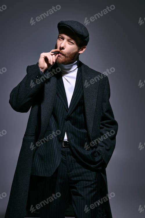 Preview: Handsome man with red hair showcasing stylish fashion in a modern setting