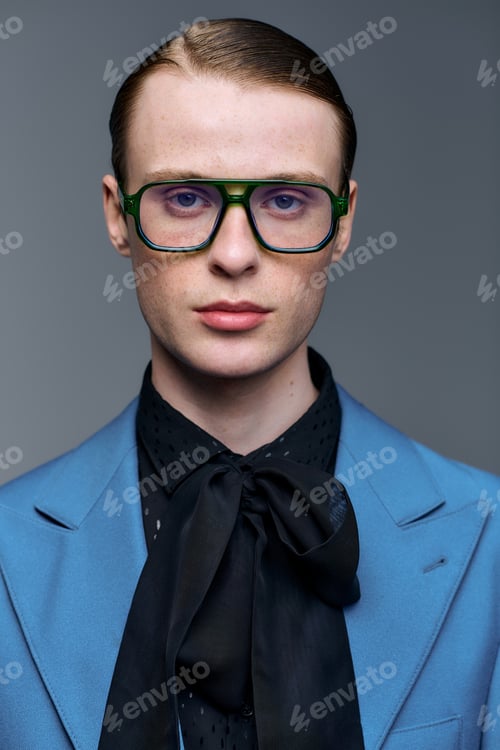 Preview: Young man showcases innovative fashion style in modern studio portrait