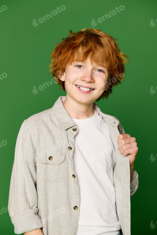 Preview: Stylish little boy brightens up the day in vibrant attire with a cheerful smile