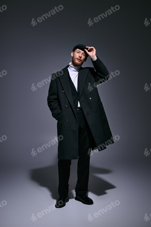 Preview: Handsome red haired man exudes charm in stylish ensemble during a dramatic studio moment