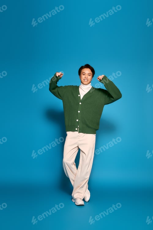 Preview: Young man expresses his unique style and vibrant personality in a studio setting