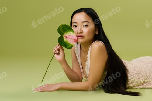 Preview: Young asian woman in a stylish summer outfit captures elegance and beauty in studio