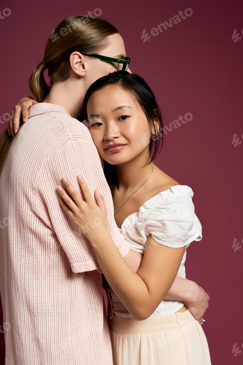 Preview: Young couple sharing a tender moment of affection in a cozy setting