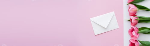 Preview: Top View of Envelope Near Blossoming Tulips on White and Pink, Banner