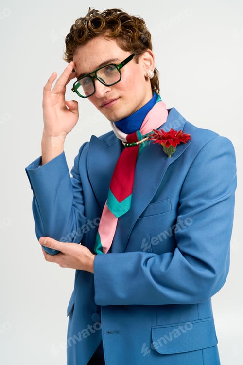 Preview: Stylish young man expresses unique fashion sense in trendy studio setting