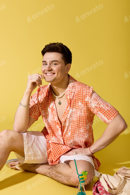Preview: Stylish young man enjoying summer vibes with a vibrant background and cheerful expression