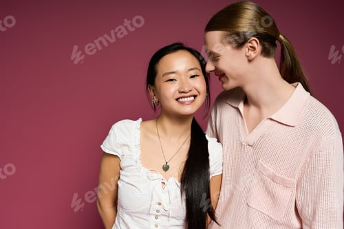 Preview: Young couple enjoying a tender moment of love and connection against a vibrant backdrop