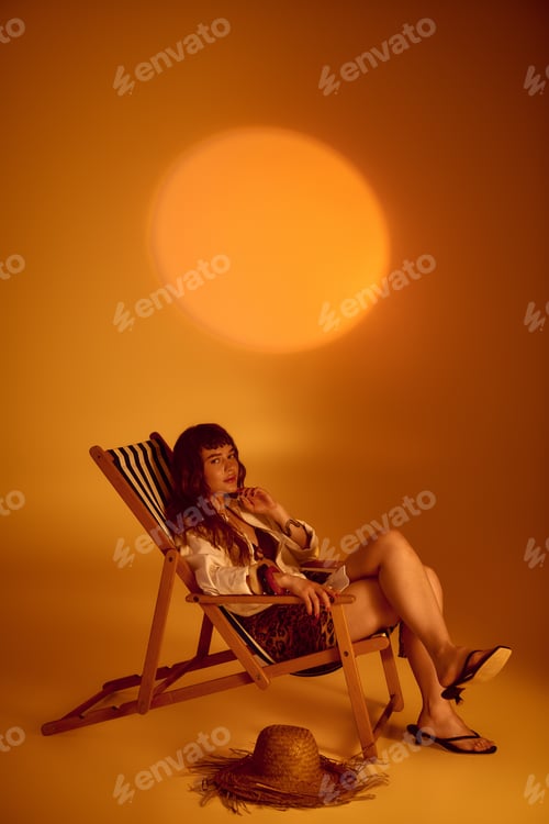 Preview: Stunning young woman lounges in summer warmth, embracing the joy of sunlit moments