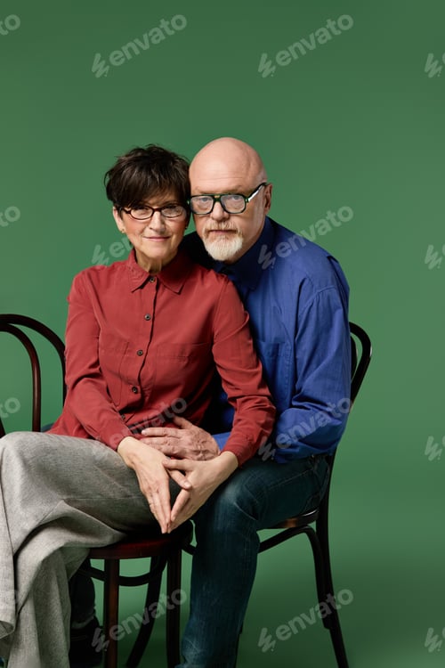 Preview: Senior couple shares a warm embrace, radiating love and connection in a cozy setting