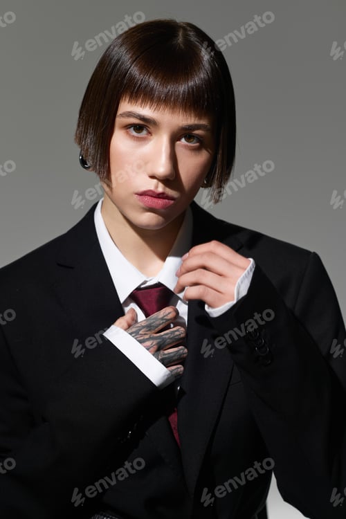 Preview: Young fashionable woman showcasing modern style in a sleek outfit and captivating pose