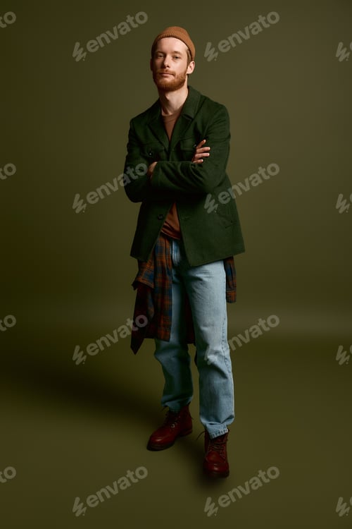 Preview: Stylish young man poses confidently in modern casual fashion with a unique vibe