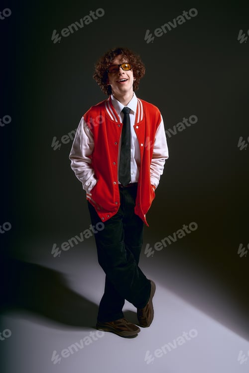 Preview: Handsomeness shines through in a stylish young mans joyful expression during evening hours