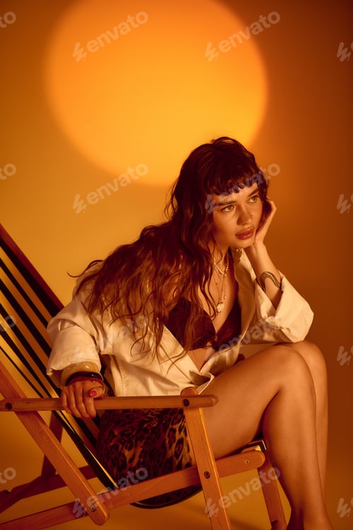 Preview: Capturing summer vibes with a chic young woman in a cozy chair under vibrant sunlight