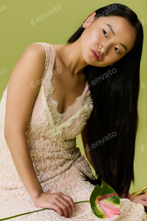 Preview: Elegance personified in summer fashion by a young Asian woman in a vibrant studio setting