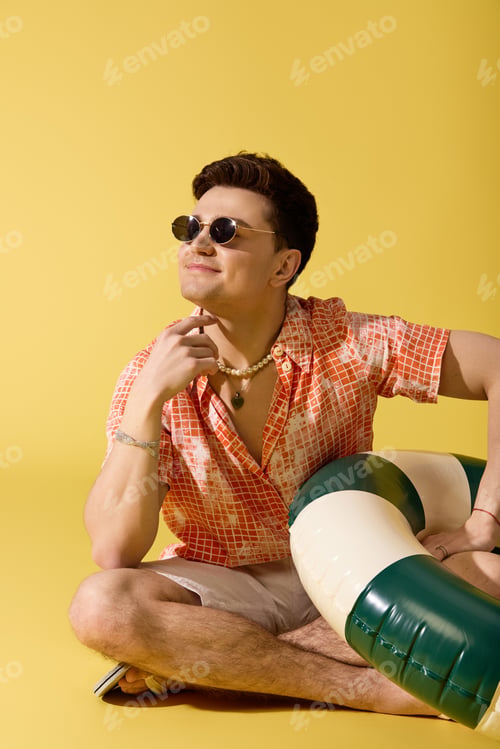 Preview: Stylish young man enjoying a sunny summer day with vibrant fashion and playful vibes