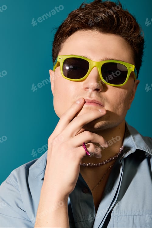 Preview: Stylish young man enjoying summertime vibes with flair and confidence