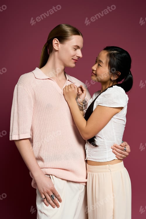 Preview: Young couple shares a tender moment while gazing into each other’s eyes in a cozy setting