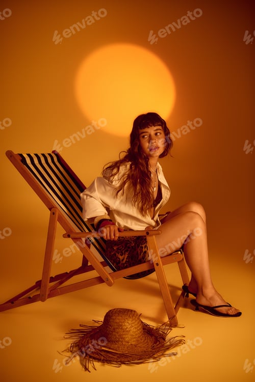 Preview: Vibrant young woman enjoys a sunny summer afternoon in a stylish chair
