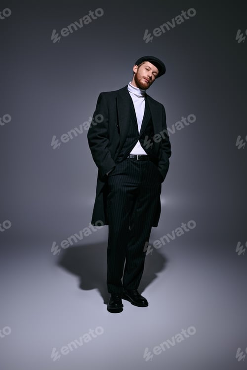 Preview: Handsome red haired man in stylish attire exudes confidence and elegance in a modern setting