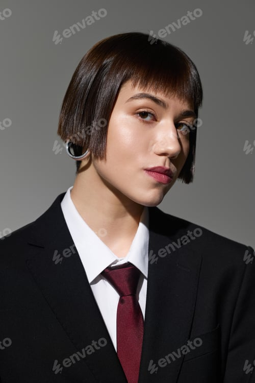 Preview: Young fashionable woman exudes confidence in stylish attire during indoor photoshoot