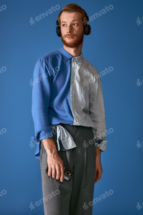 Preview: Handsome red haired man showcases unique fashion sense with stylish ensemble and accessories