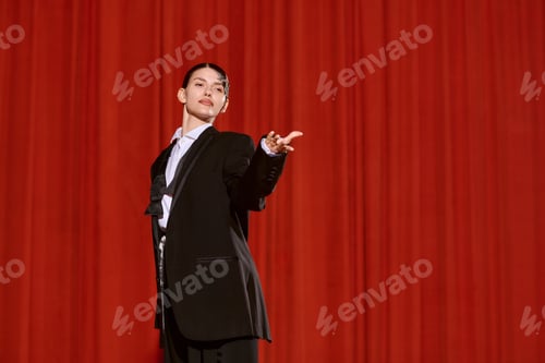 Preview: Artistic woman captivating the audience on stage in a vibrant theatre setting