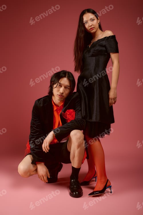 Preview: Young couple expressing love and style in a vibrant fashion setting filled with bold colors