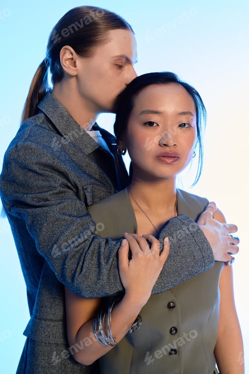 Preview: Young couple sharing tender moments together in a creative, artistic setting