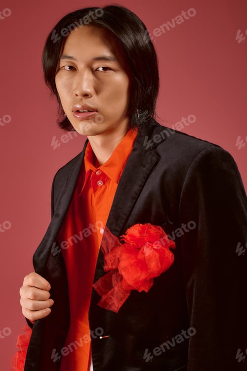 Preview: Young man embraces style and fashion with elegant flair in a vibrant setting