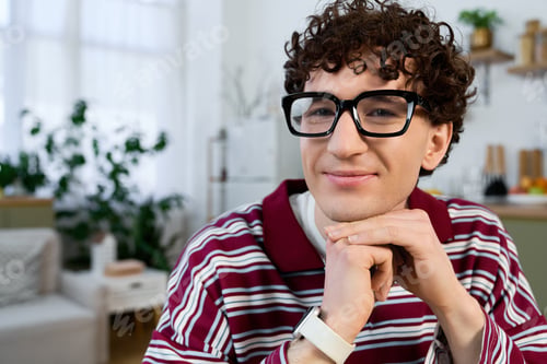 Preview: Young man enjoys his cozy modern apartment lifestyle with casual style and charm