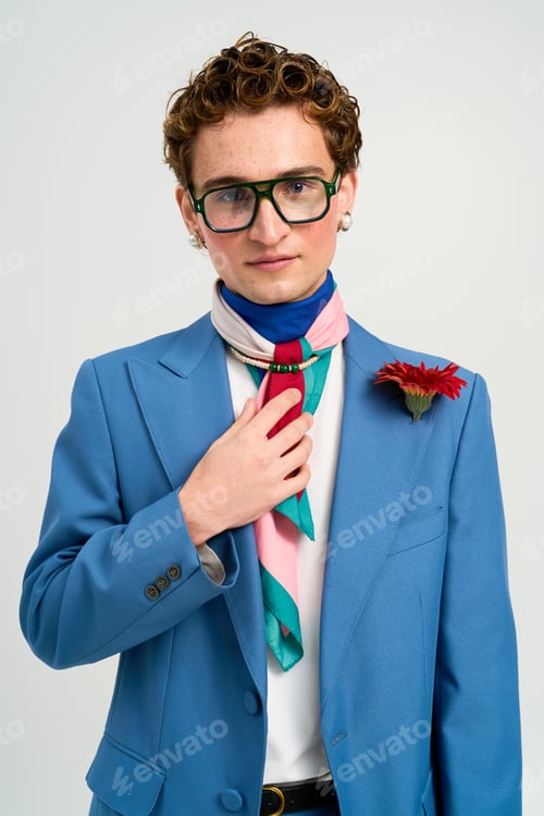Preview: Stylish young man displays trendy fashion and vibrant outfit in a modern studio setting
