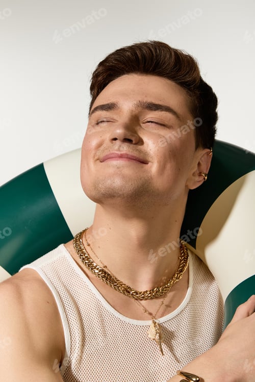 Preview: Stylish young man enjoying summertime vibes with a trendy look and laid back attitude