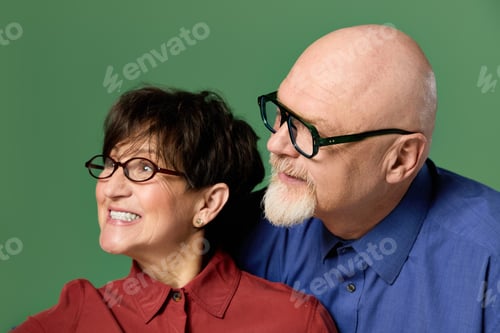 Preview: Joyful seniors sharing a moment of love and happiness against a vibrant background