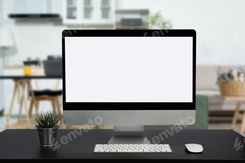 Preview: Workspace with simulated blank white screen computers and office equipment on a wooden table.