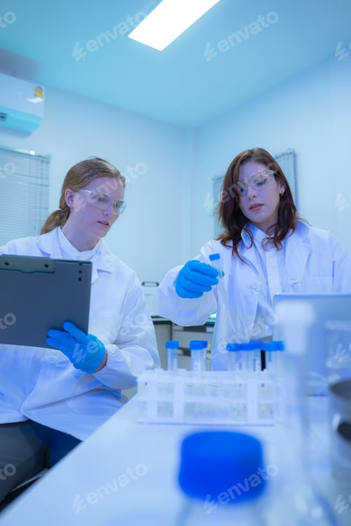 Preview: Diverse Scientists Conduct Biotechnology Research in Modern Laboratory